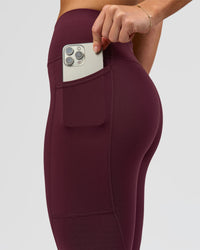 Woman wearing Rep Ultra High-Rise 7/8 Legging Pockets - Cherry Lacquer-White | Model:Issy | Size:XS | Thumbnail Index: 5