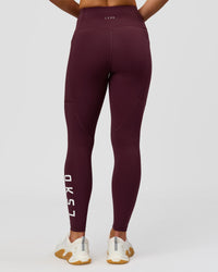 Woman wearing Rep Ultra High-Rise 7/8 Legging Pockets - Cherry Lacquer-White | Model:Issy | Size:XS | Thumbnail Index: 7