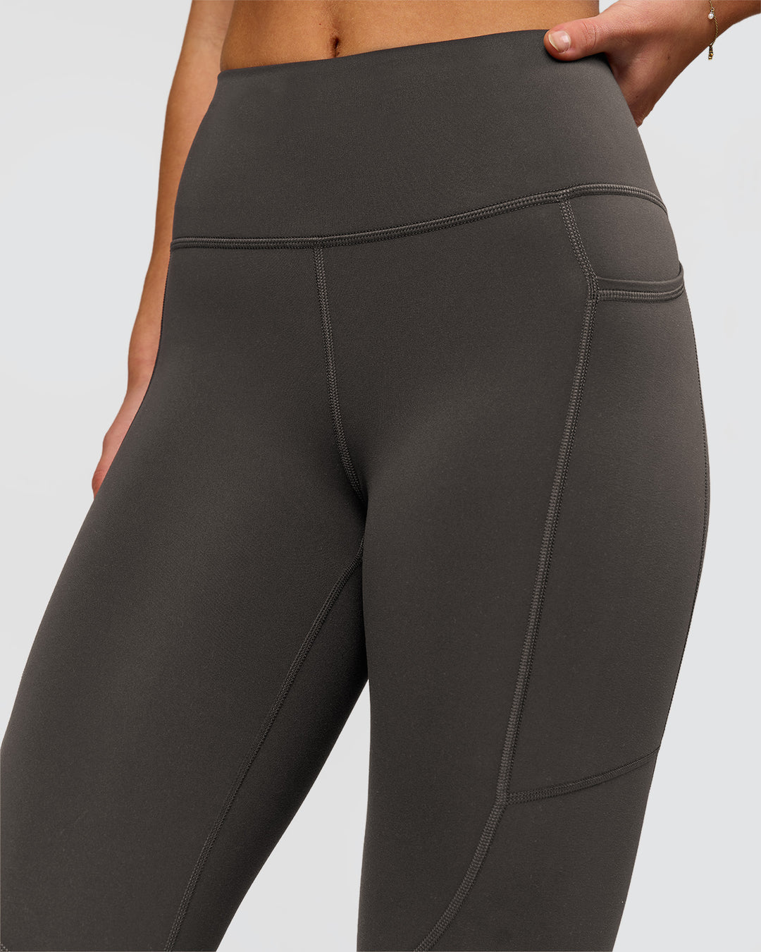 Woman wearing Rep Ultra High-Rise 7/8 Legging Pockets - Onyx-white | Model:Issy | Size:XS - view 4