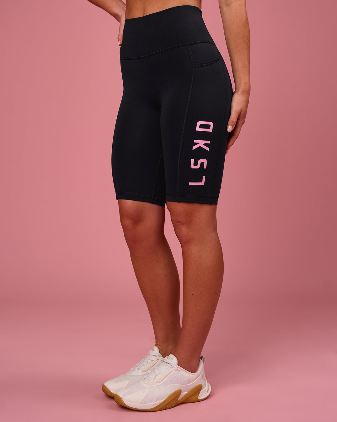 Woman wearing Rep Ultra High-Rise 9" Short Pockets - Black-Pink Rose | Model:Issy | Size:XS - view 6
