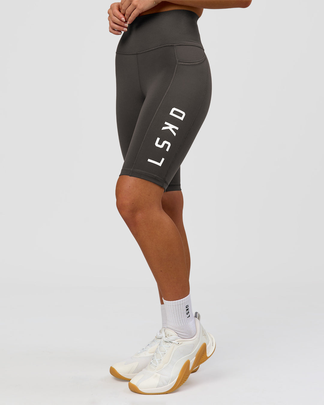 Woman wearing Rep Ultra High-Rise 9" Short Pockets - Onyx-white | Model:Issy | Size:XS - view 1