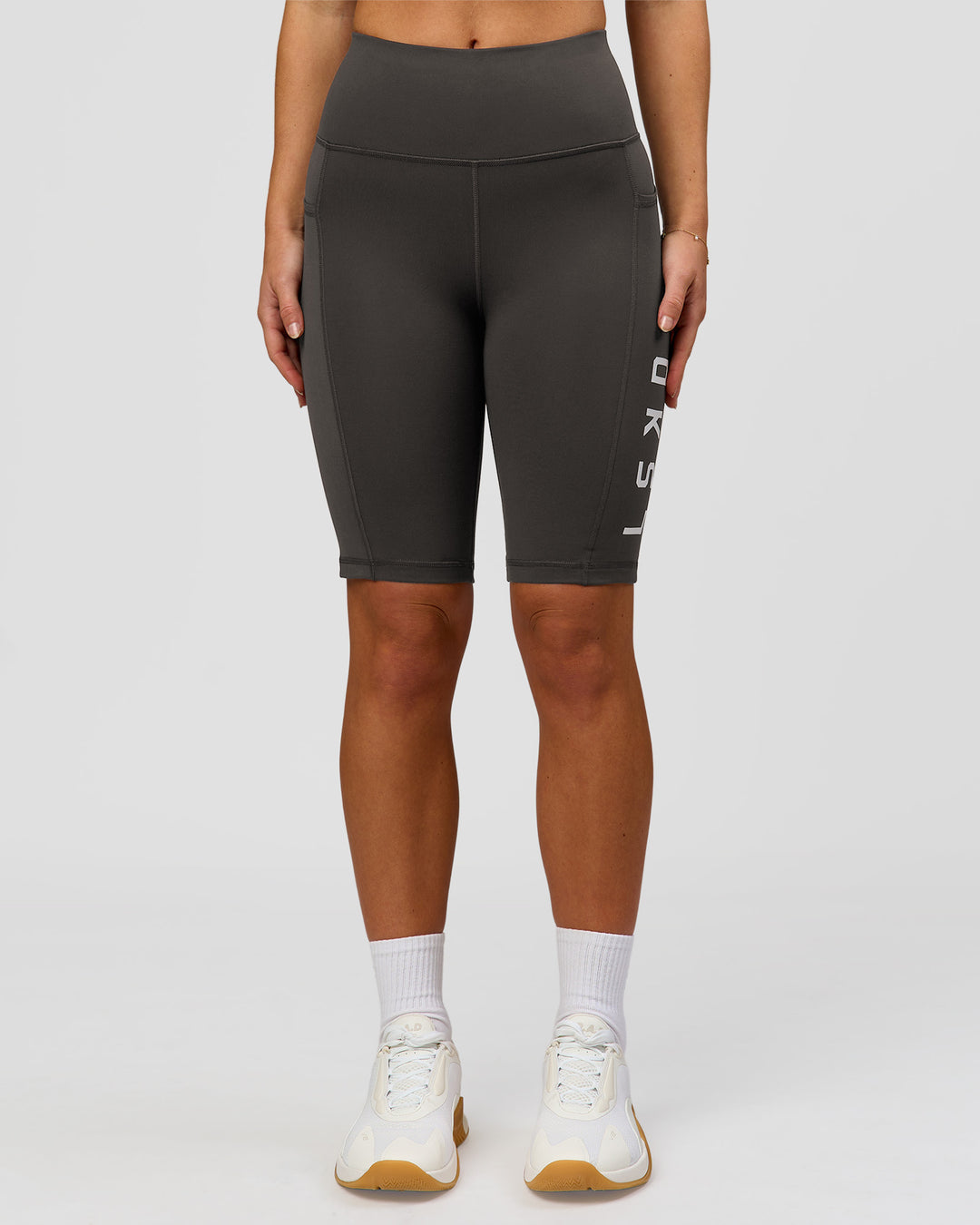Woman wearing Rep Ultra High-Rise 9" Short Pockets - Onyx-white | Model:Issy | Size:XS - view 4