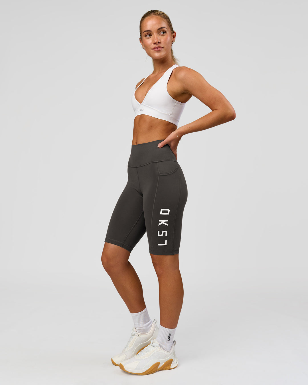 Woman wearing Rep Ultra High-Rise 9" Short Pockets - Onyx-white | Model:Issy | Size:XS - view 5