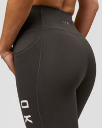 Woman wearing Rep Ultra High-Rise 9" Short Pockets - Onyx-white | Model:Issy | Size:XS | Thumbnail Index: 6