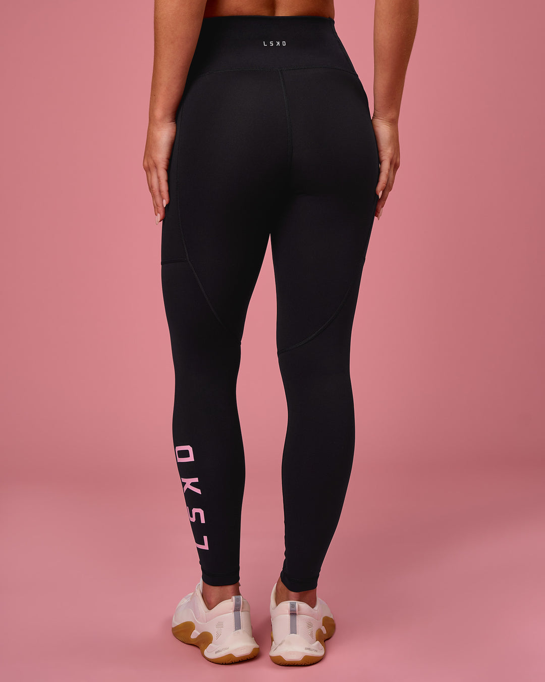Woman wearing Rep Ultra High-Rise Full Length Legging Pockets - Black-Pink Rose | Model:Issy | Size:XS - view 2
