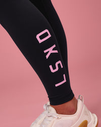 Woman wearing Rep Ultra High-Rise Full Length Legging Pockets - Black-Pink Rose | Model:Issy | Size:XS | Thumbnail Index: 2