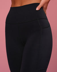 Woman wearing Rep Ultra High-Rise Full Length Legging Pockets - Black-Pink Rose | Model:Issy | Size:XS | Thumbnail Index: 7