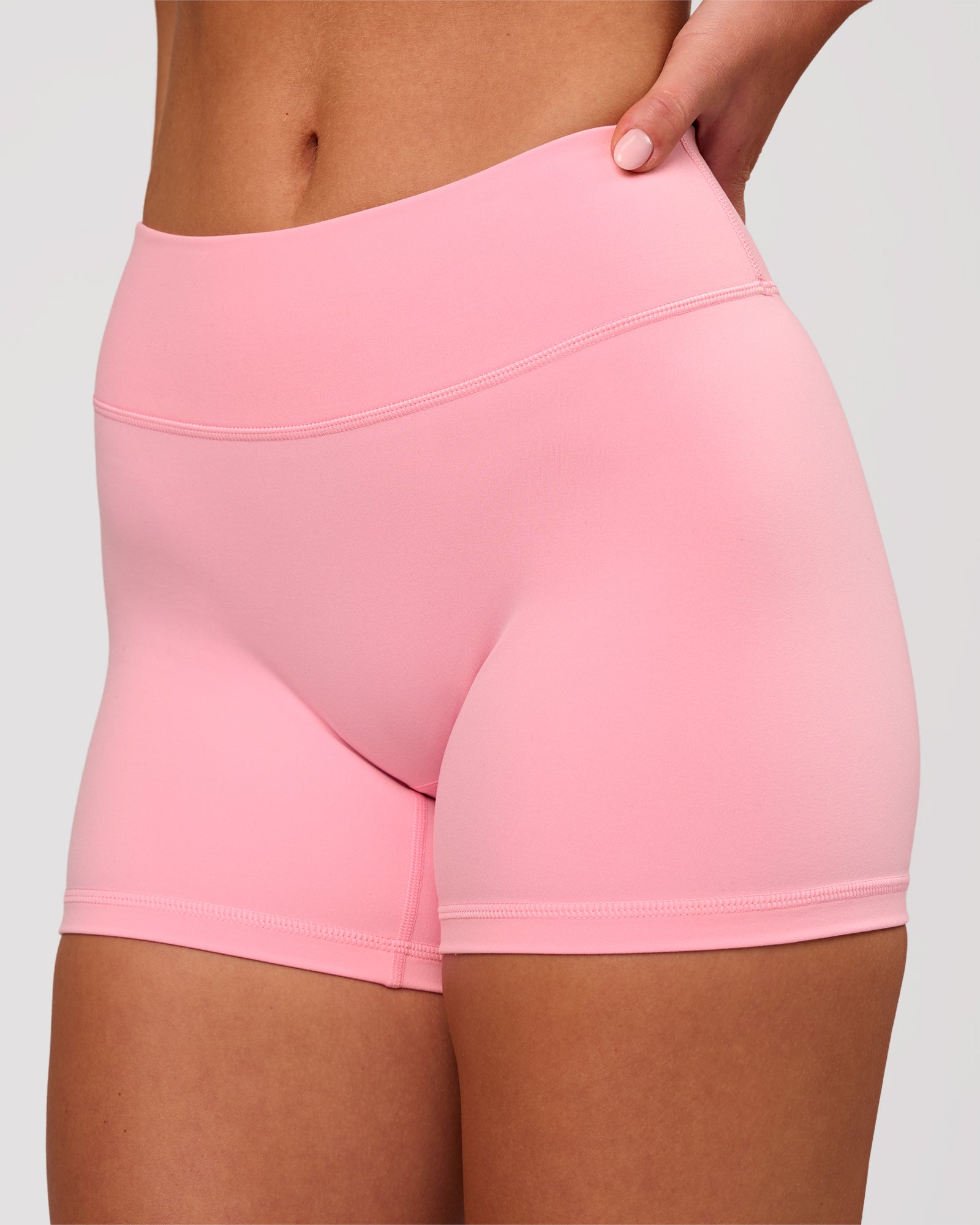 Woman wearing RXD Mid-Rise 4" Short - Pink Rose | Model:Issy | Size:XS