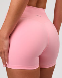 Woman wearing RXD Mid-Rise 4" Short - Pink Rose | Model:Issy | Size:XS | Thumbnail Index: 2