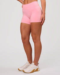 Woman wearing RXD Mid-Rise 4" Short - Pink Rose | Model:Issy | Size:XS | Thumbnail Index: 4