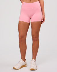 Woman wearing RXD Mid-Rise 4" Short - Pink Rose | Model:Issy | Size:XS | Thumbnail Index: 6