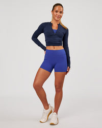 Woman wearing RXD Mid-Rise 4" Short - Power Cobalt | Model:Issy | Size:XS | Thumbnail Index: 2