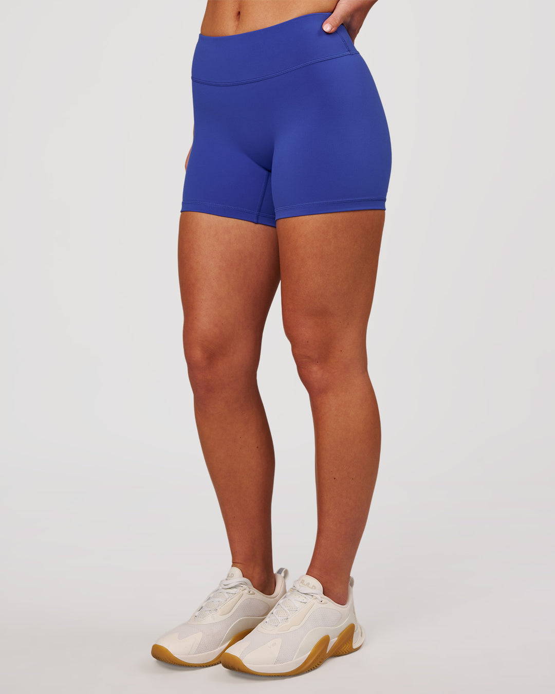 Woman wearing RXD Mid-Rise 4" Short - Power Cobalt | Model:Issy | Size:XS - view 6