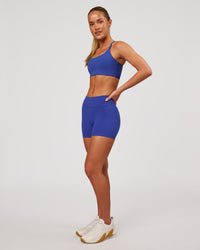 Woman wearing RXD Mid-Rise 4" Short - Power Cobalt | Model:Issy | Size:XS | Thumbnail Index: 7