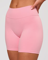 Woman wearing RXD Mid-Rise 6" Short - Pink Rose | Model:Issy | Size:XS | Thumbnail Index: 0