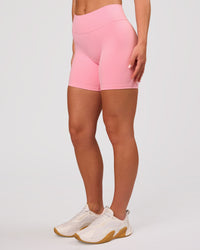 Woman wearing RXD Mid-Rise 6" Short - Pink Rose | Model:Issy | Size:XS | Thumbnail Index: 5