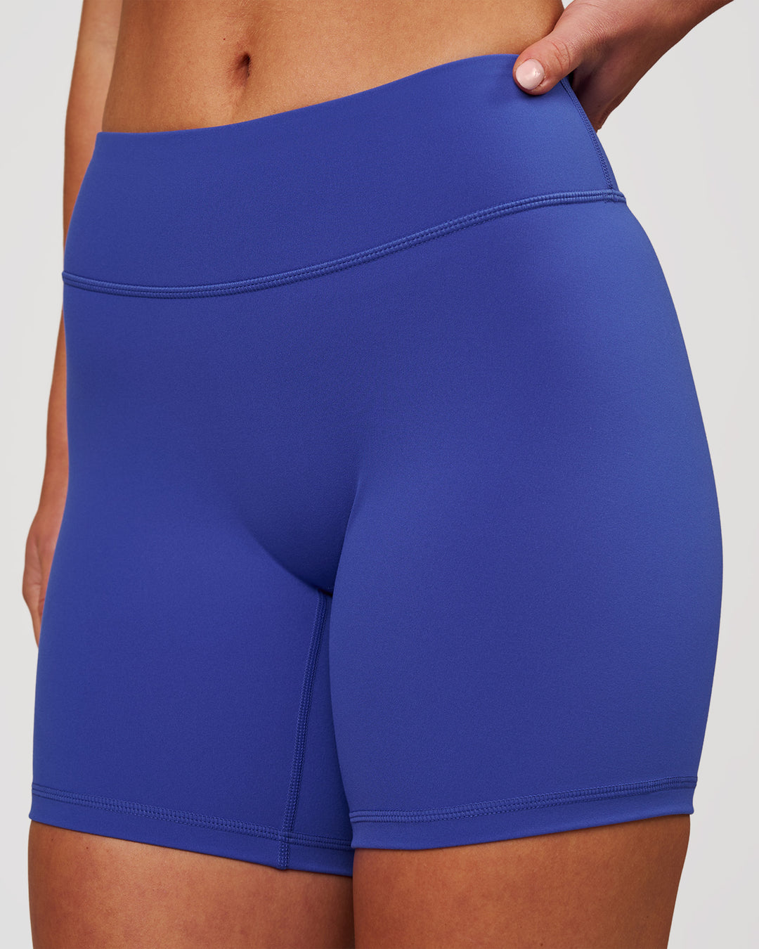 Woman wearing RXD Mid-Rise 6" Short - Power Cobalt | Model:Issy | Size:XS - view 1