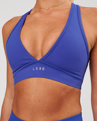Woman wearing Stamina Sports Bra - Power Cobalt | Model:Issy | Size:XS | Thumbnail Index: 0