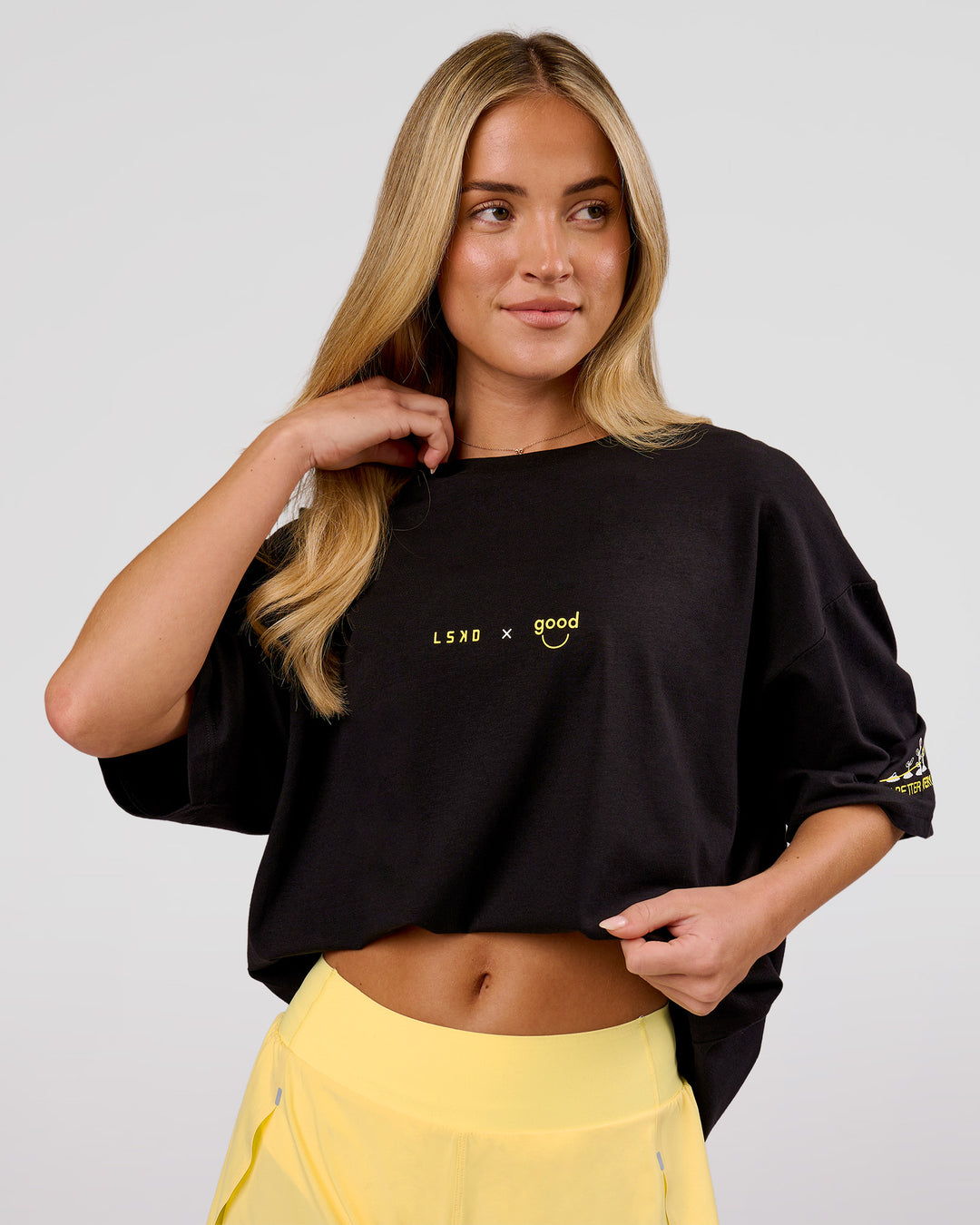 Woman wearing TGHF X LSKD 26 FLXCotton Oversized Tee - Black | Model:Issy | Size:XS - view 4