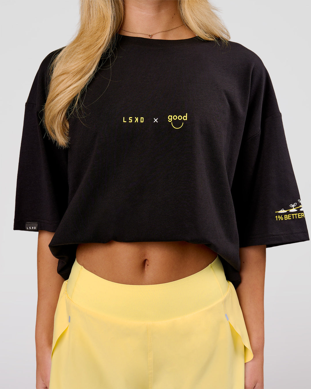 Woman wearing TGHF X LSKD 26 FLXCotton Oversized Tee - Black | Model:Issy | Size:XS - view 6