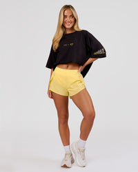Woman wearing TGHF X LSKD 26 FLXCotton Oversized Tee - Black | Model:Issy | Size:XS | Thumbnail Index: 13
