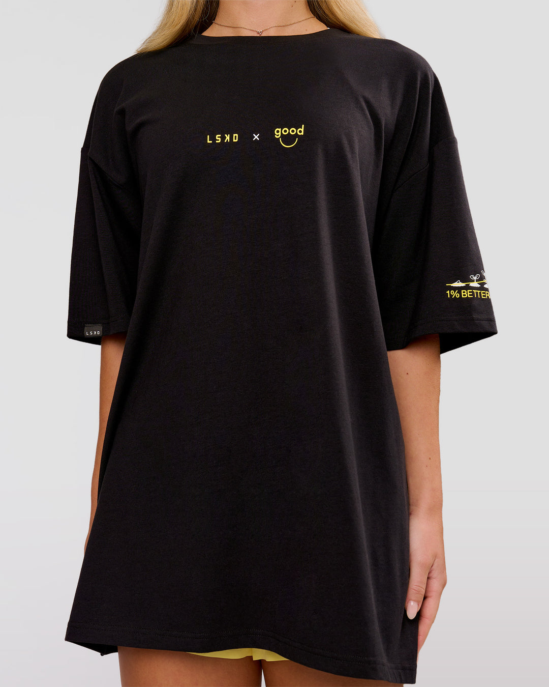 Woman wearing TGHF X LSKD 26 FLXCotton Oversized Tee - Black | Model:Issy | Size:XS - view 15