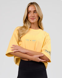 Woman wearing TGHF X LSKD 26 FLXCotton Oversized Tee - Lemon | Model:Issy | Size:XS | Thumbnail Index: 3