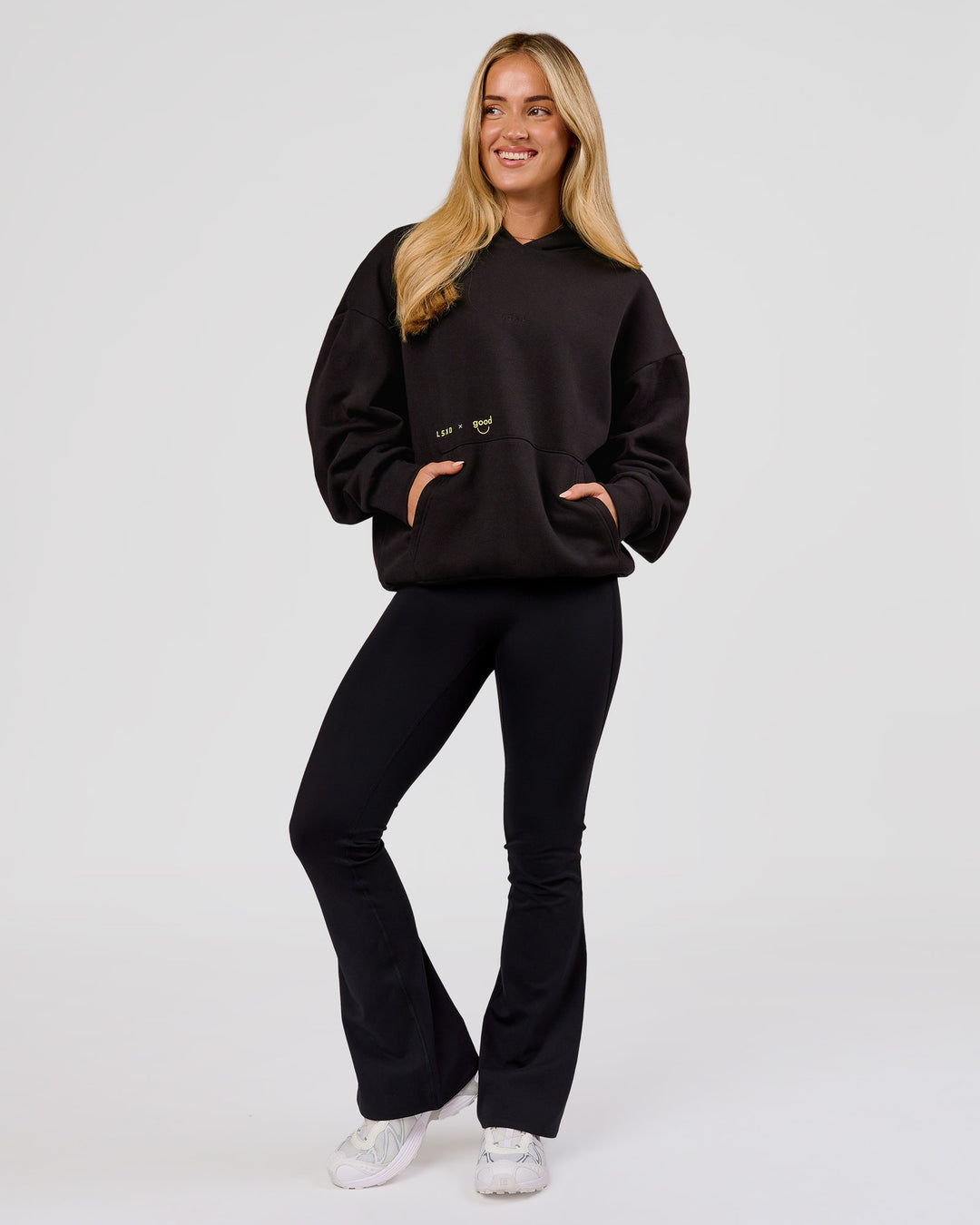 Woman wearing TGHF X LSKD 26 Oversized Hoodie - Black | Model:Issy | Size:XS - view 15