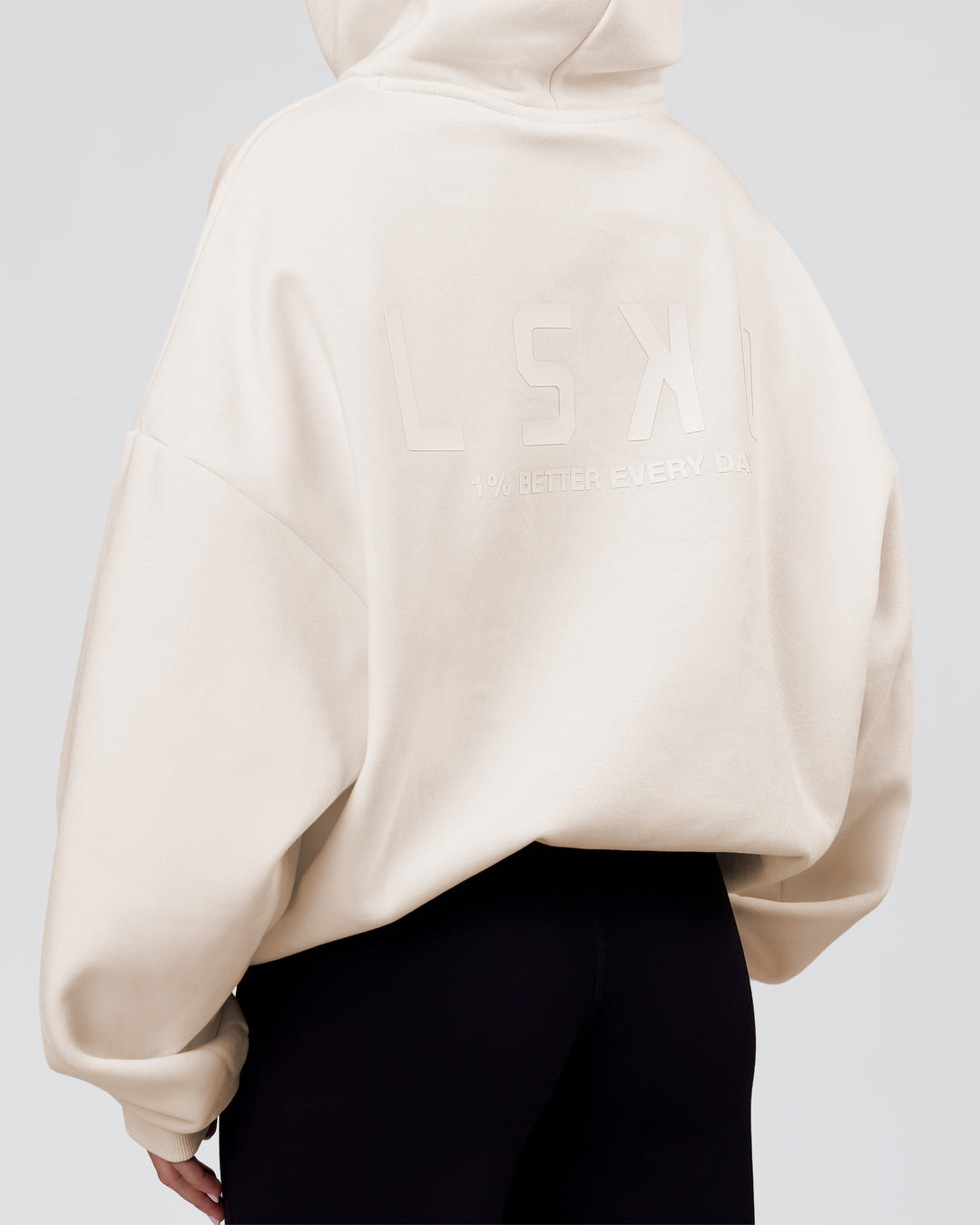 Woman wearing Tonal Legacy Boxy Hoodie - Off White-Off White | Model:Issy | Size:XS - view 14