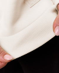Woman wearing Tonal Legacy Boxy Hoodie - Off White-Off White | Model:Issy | Size:XS | Thumbnail Index: 19