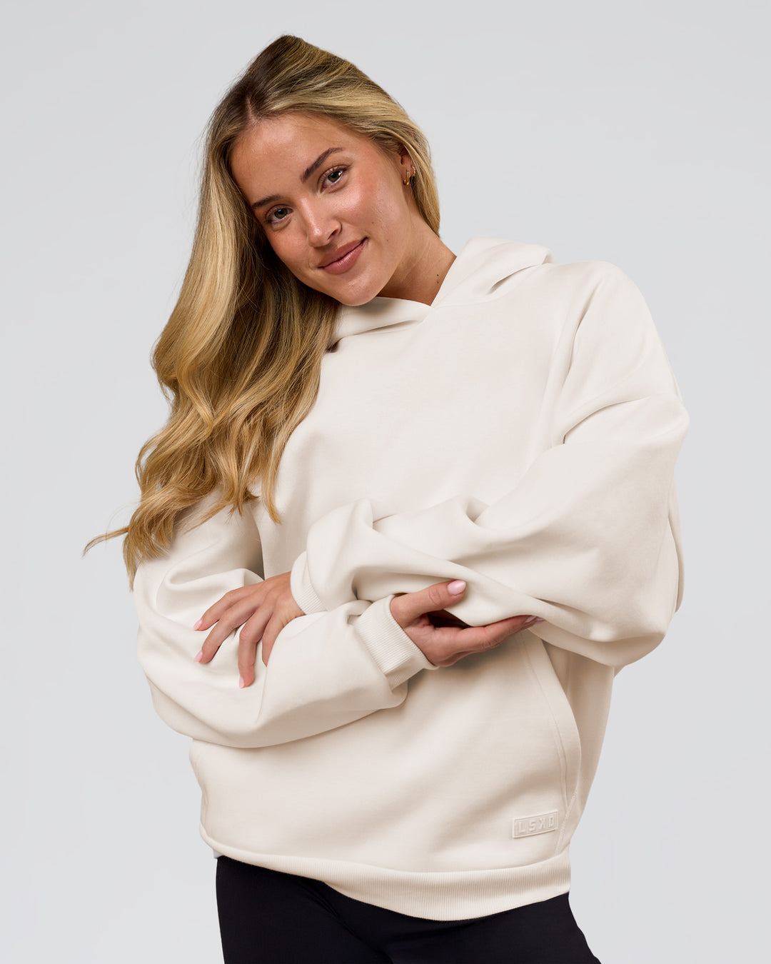 Woman wearing Tonal Legacy Boxy Hoodie - Off White-Off White | Model:Issy | Size:XS - view 22