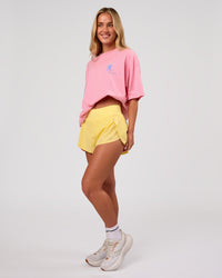 Woman wearing Values Manifesto Heavyweight Oversized Tee  - Pink Rose-Open Air | Model:Issy | Size:XS | Thumbnail Index: 9