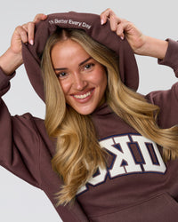 Woman wearing Varsity Boxy Hoodie - Cocoa Powder-Off White | Model:Issy | Size:XS | Thumbnail Index: 10