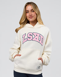 Woman wearing Varsity Boxy Hoodie - Off White-Pink Rose | Model:Issy | Size:XS | Thumbnail Index: 11