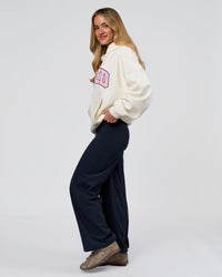 Woman wearing Varsity Boxy Hoodie - Off White-Pink Rose | Model:Issy | Size:XS | Thumbnail Index: 19