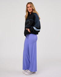 Woman wearing Vibe Oversized Hoodie - Black-Future Navy | Model:Issy | Size:XS | Thumbnail Index: 9