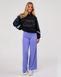Woman wearing Vibe Oversized Hoodie - Black-Future Navy | Model:Issy | Size:XS | Thumbnail Index: 11