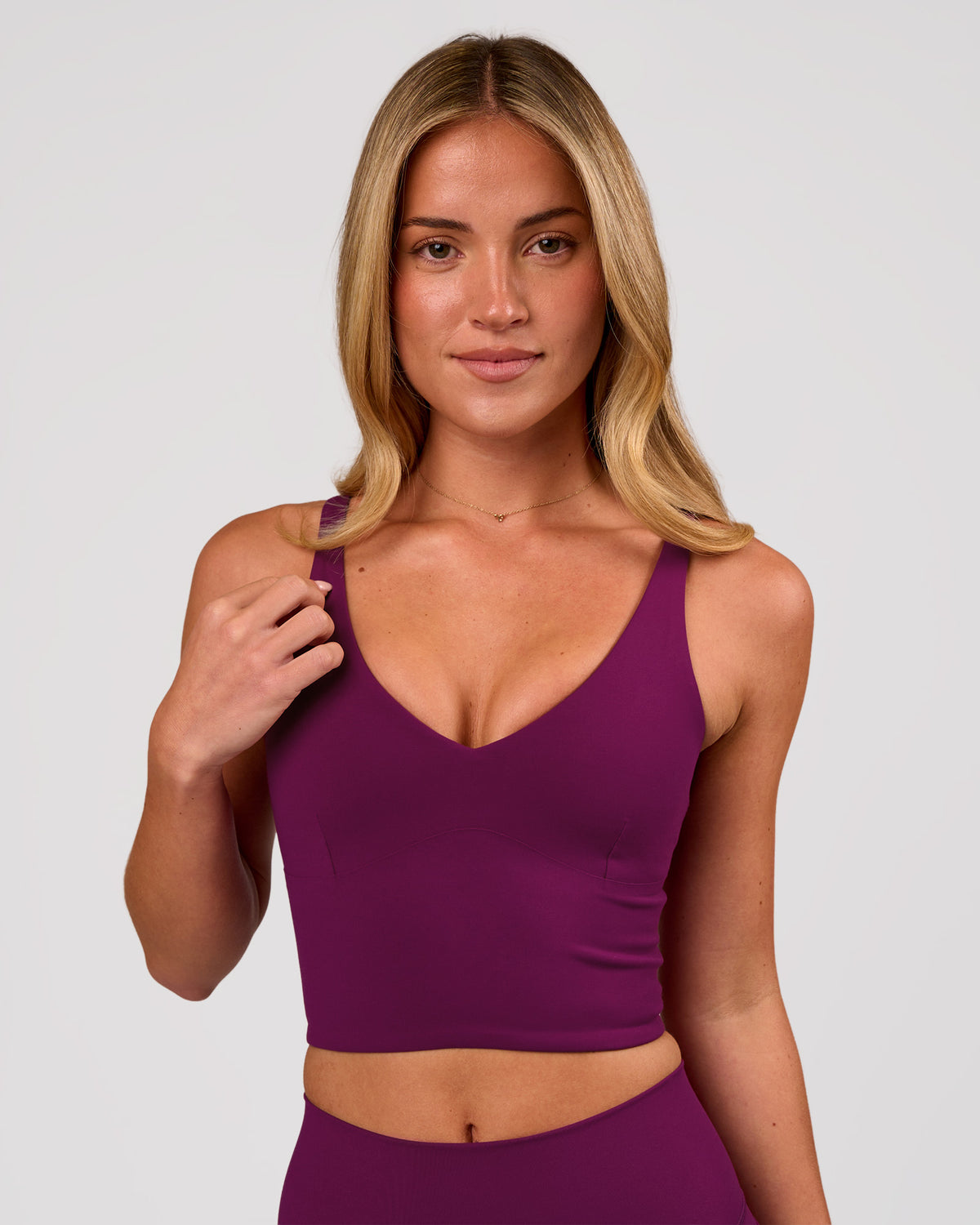 Woman wearing Vitality Long Line Sports Bra - Plum Caspia | Model:Issy | Size:XS