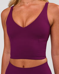 Woman wearing Vitality Long Line Sports Bra - Plum Caspia | Model:Issy | Size:XS | Thumbnail Index: 2