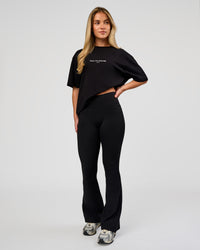 Woman wearing VS1 Enjoy The Journey FLXCotton Oversize Tee - Black | Model:Issy | Size:XS | Thumbnail Index: 10