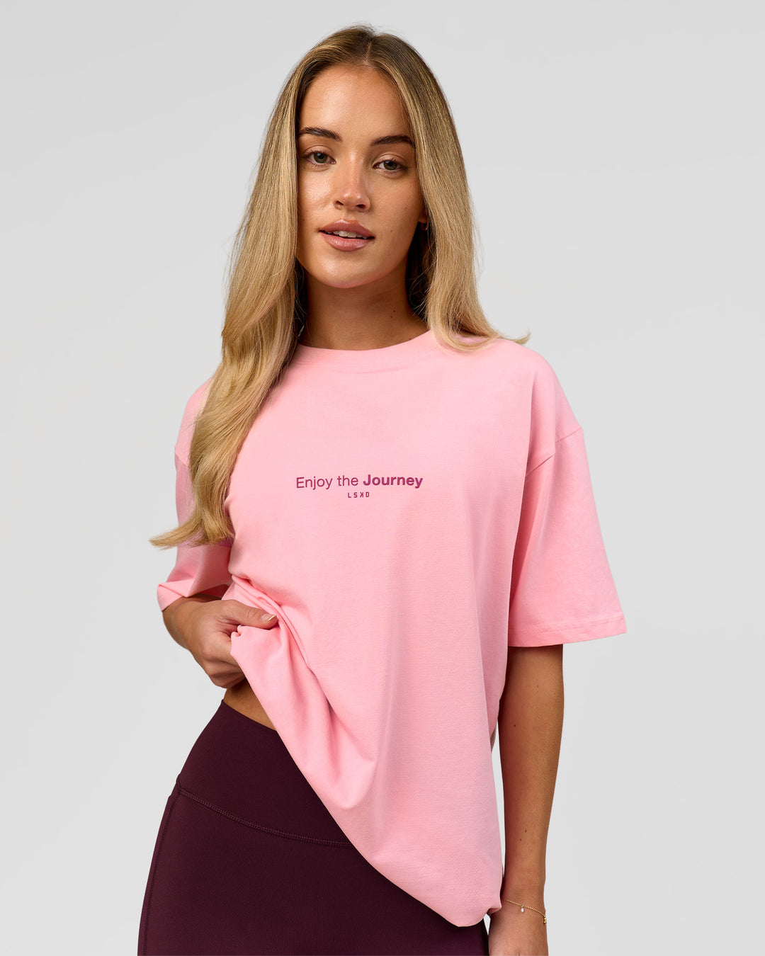 Woman wearing VS1 Enjoy The Journey FLXCotton Oversize Tee - Pink Rose | Model:Issy | Size:XS - view 3