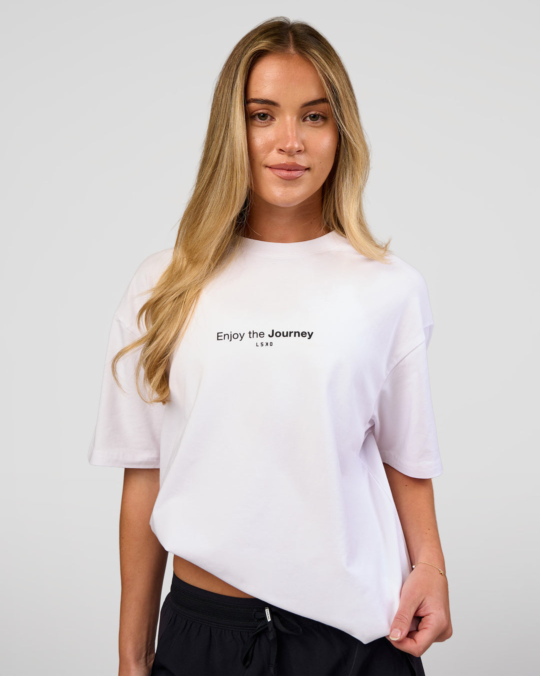 Woman wearing VS1 Enjoy The Journey FLXCotton Oversize Tee - White | Model:Issy | Size:XS - view 3