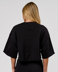 Woman wearing Go-To Terry Oversized Tee - Black | Model:Issy | Size:XS | Thumbnail Index: 3