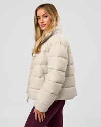 Woman wearing Go-To Puffer Jacket - Shale Beige | Model:Izzy | Size:XS