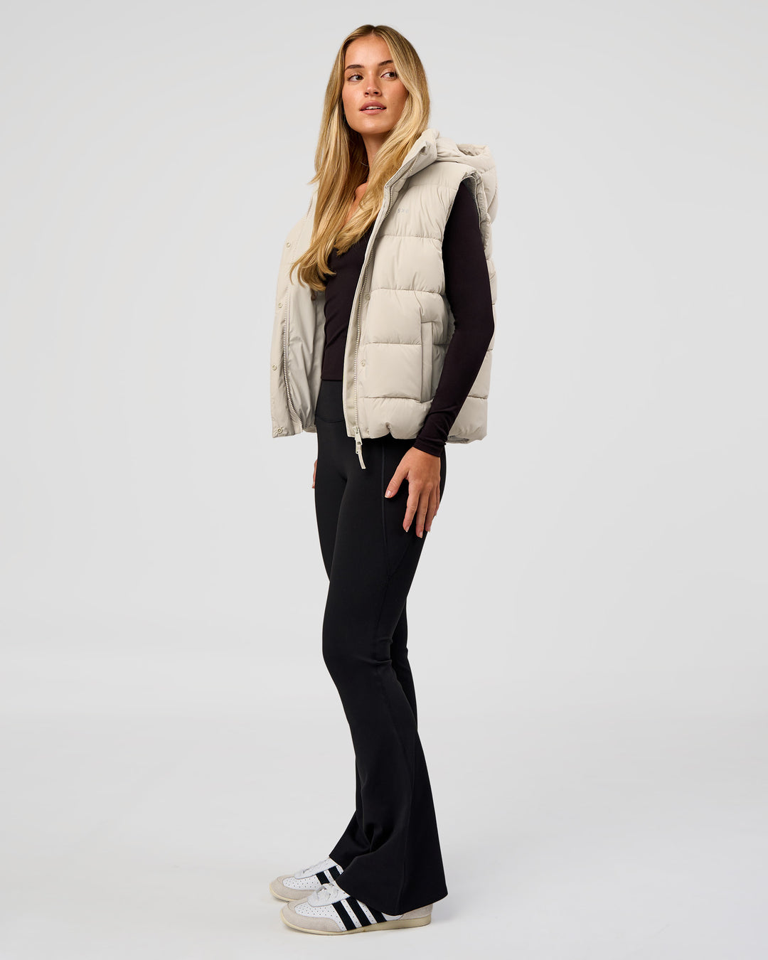 Woman wearing Go-To Puffer Vest - Shale Beige | Model:Izzy | Size:XS
