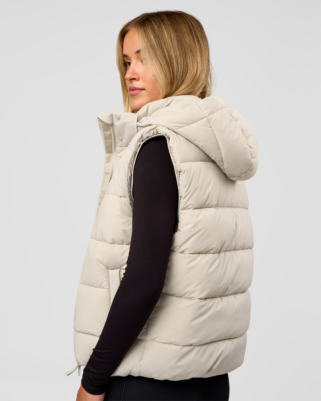 Woman wearing Go-To Puffer Vest - Shale Beige | Model:Izzy | Size:XS