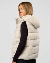 Woman wearing Go-To Puffer Vest - Shale Beige | Model:Izzy | Size:XS