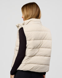 Woman wearing Go-To Puffer Vest - Shale Beige | Model:Izzy | Size:XS