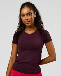 Woman wearing AeroFLX+ Seamless Tee - Cherry Lacquer/Cherry Lacquer | Model:Jordan | Size:XS | Thumbnail Index: 0
