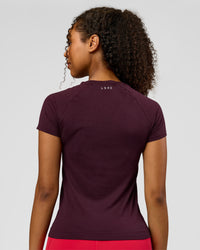 Woman wearing AeroFLX+ Seamless Tee - Cherry Lacquer/Cherry Lacquer | Model:Jordan | Size:XS | Thumbnail Index: 1